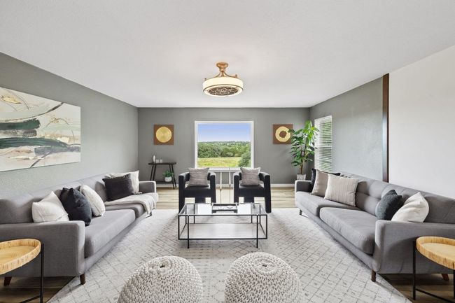 Living room with light wood-style floors and baseboards | Image 22