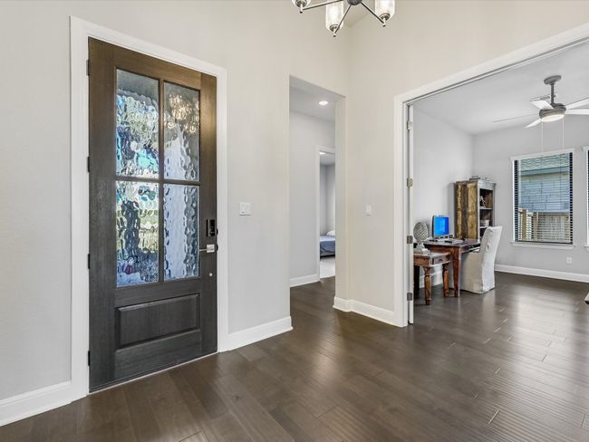 Entryway with a chandelier, wood finished floors, healthy amount of natural light, and ceiling fan | Image 5