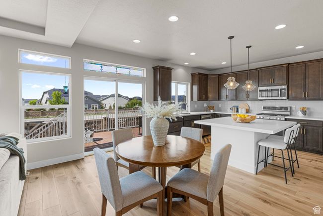 Dining area featuring light wood-style floors, recessed lighting, and baseboards | Image 9