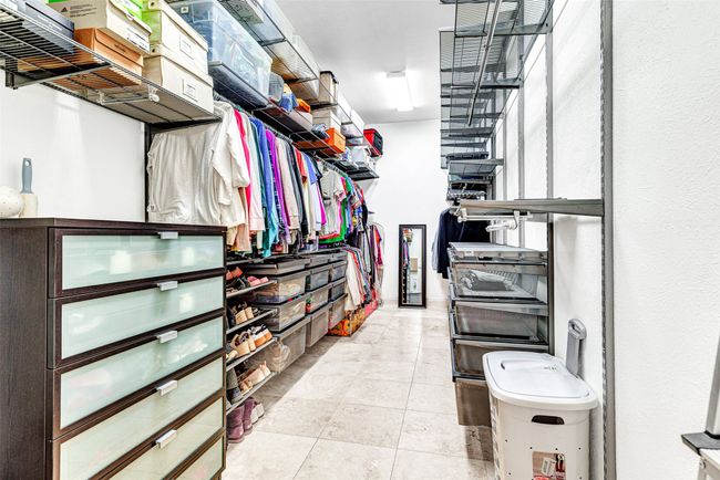 You just may want to move into this closet with custom floor to ceiling (10ft ceiling) closet shelving and drawers from Container Store! No excuse not to have all your clothes and accessories neat and organized! | Image 12