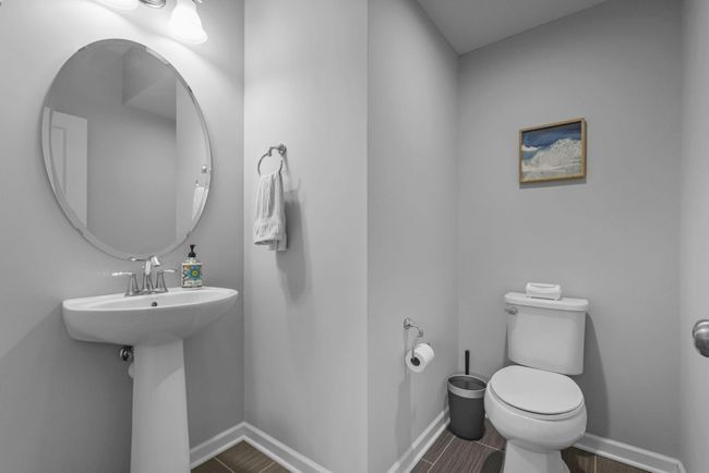Main floor 1/2 bath is smart and functional. | Image 19