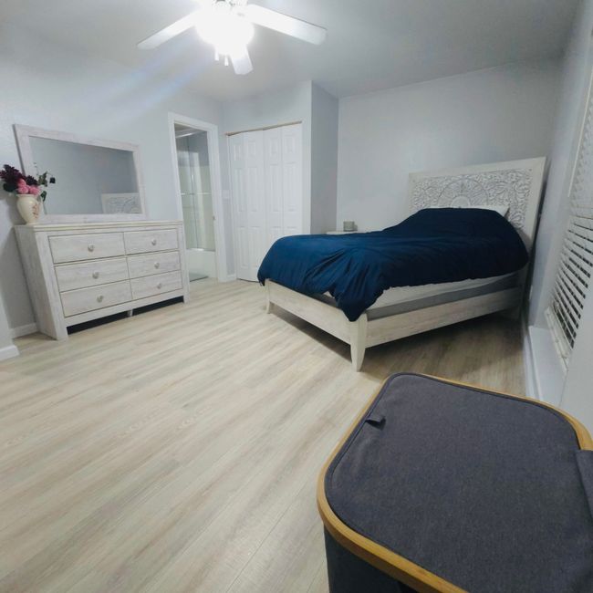 Bedroom 3 featuring wood finished floors, a ceiling fan, and a closet | Image 24