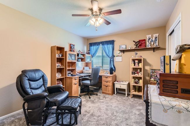 Office area with ceiling fan, light carpet, and baseboards | Image 18