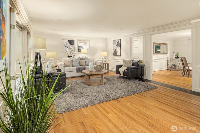 Light and airy, take in the essence of classically designed beauty. Freshly refinished hardwood floors are accented by a lovely slate surround adding an element of richness. | Image 6