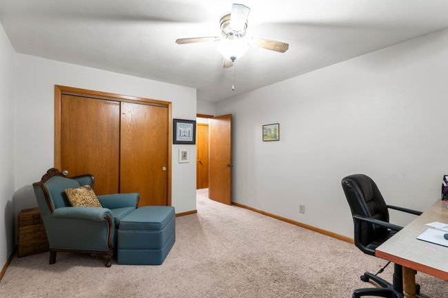 Each includes a ceiling fan, extra closet space, and windows that frame peaceful views of the yard. | Image 7