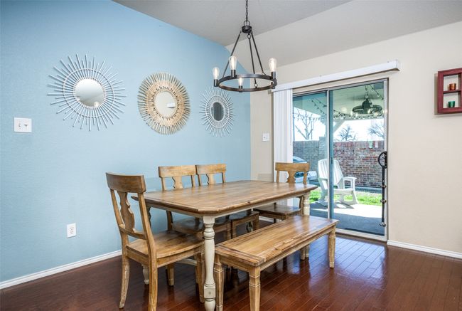 Dining space with a chandelier and wood-type flooring | Image 17