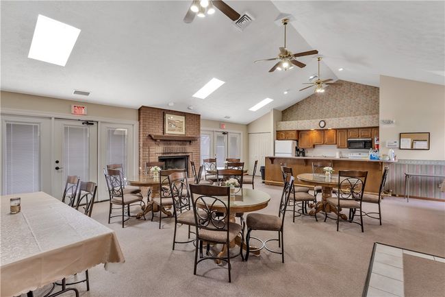 Fireplace Warms the Community Clubhouse and Vaulted Ceiling with Skylights Provide Lots of Natural Light. | Image 34