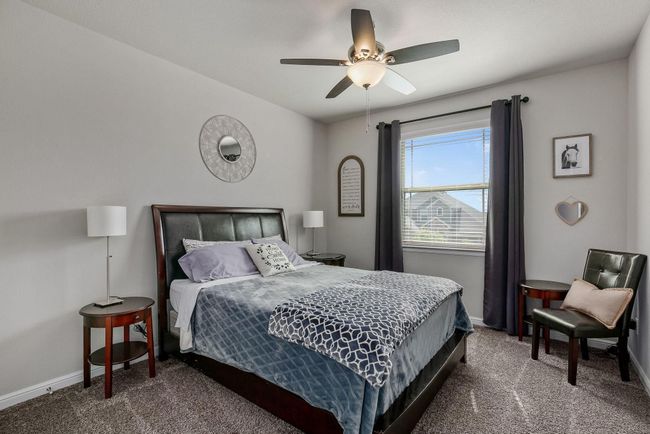 3rd bedroom featuring baseboards and ceiling fan | Image 22