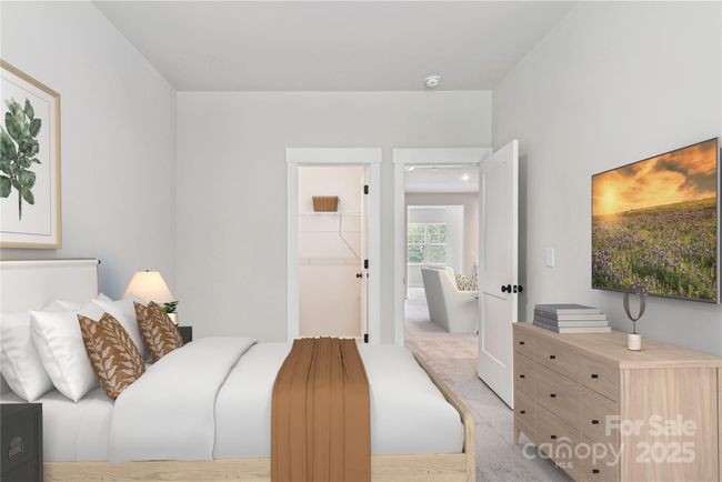 *Virtually staged representative of the Norman floorplan – not the actual home* Primary Suite on the main floor. | Image 5