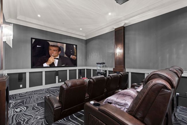 Cinema with wainscoting, recessed lighting, a decorative wall, and ornamental molding | Image 15