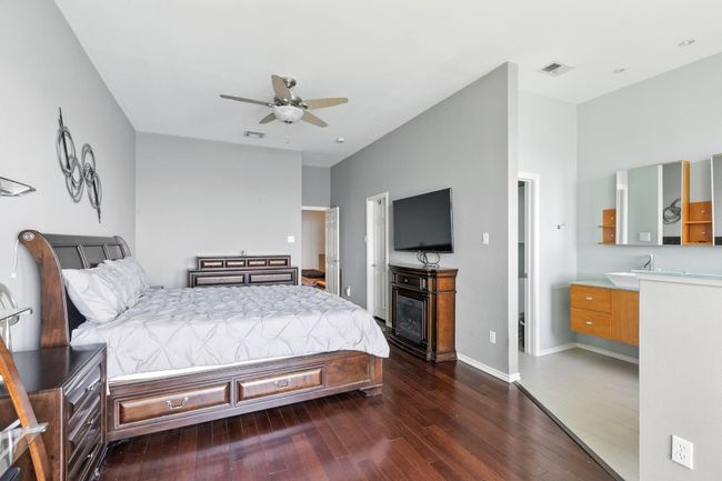 Bedroom featuring dark wood-style flooring and a ceiling fan | Image 16