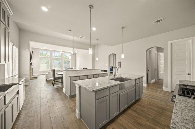Enjoy natural light pouring into your open-concept kitchen, perfect for cooking and entertaining. | Image 10