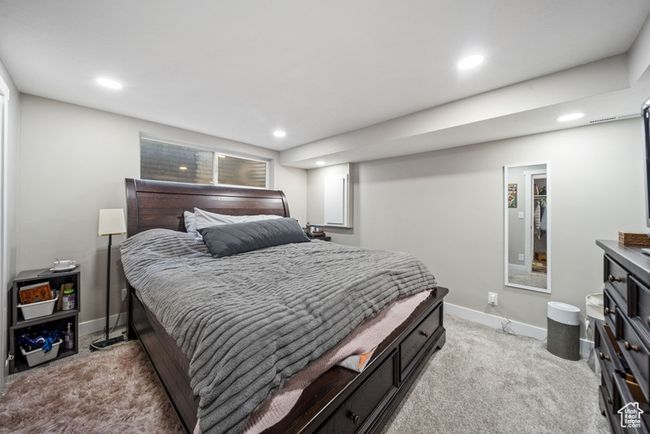 Bedroom featuring light carpet, recessed lighting, and baseboards | Image 25