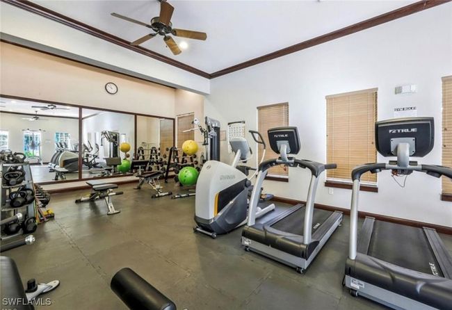 Workout area featuring baseboards, ornamental molding, and a ceiling fan | Image 28