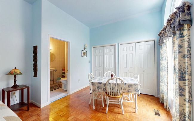 Dining room with baseboards and a high ceiling | Image 29