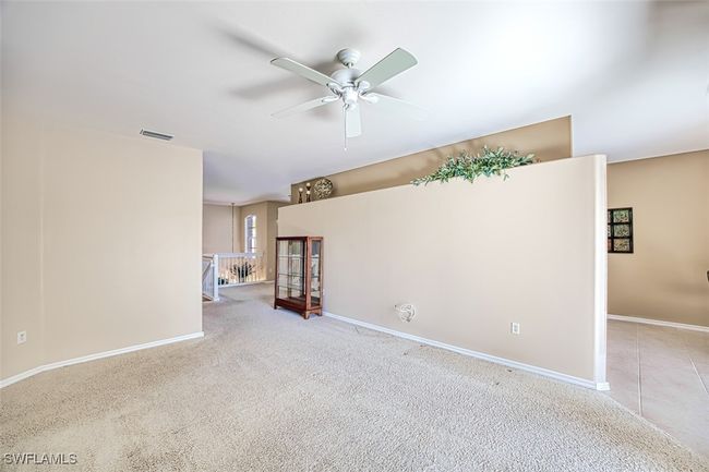 Spare room with ceiling fan and light colored carpet | Image 21