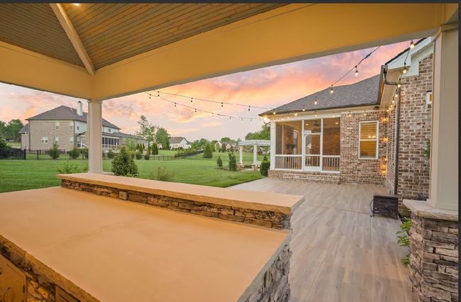 This view never gets old—whether you’re grilling, sipping a drink, or simply unwinding, this covered pavilion offers a seamless blend of comfort, style, and open-air charm. | Image 11