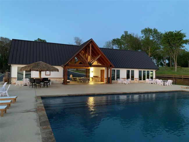 View of pool with a patio area | Image 5