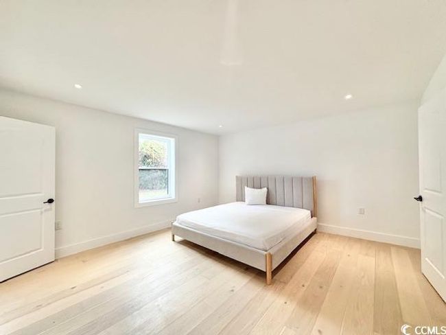 Bedroom featuring light wood-type flooring and recessed lighting | Image 31