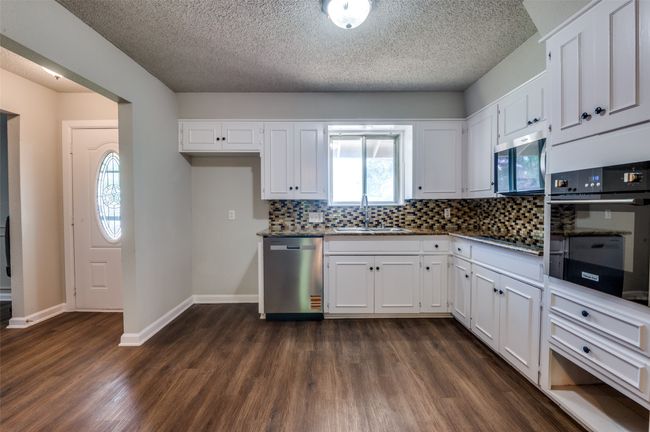 You’ll love the bright, functional kitchen and open-concept living spaces at 1216 Desiree. | Image 5