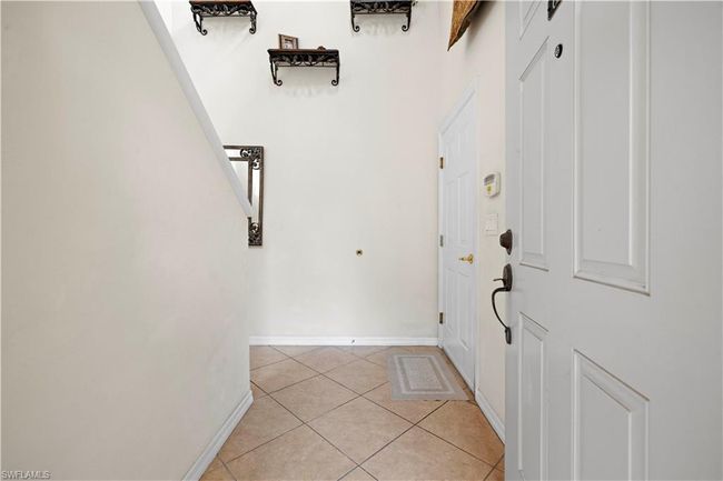 Foyer with baseboards and light tile patterned floors | Image 4