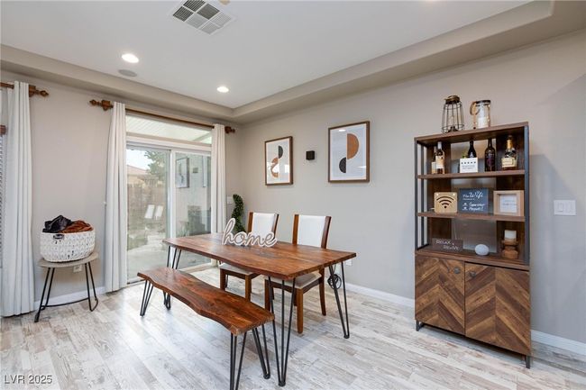 Dining space featuring recessed lighting, baseboards, visible vents, and light wood-style flooring | Image 11
