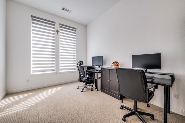 Home office featuring light carpet, plenty of natural light, and baseboards | Image 17