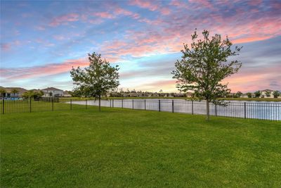 Fenced yard on lake | Image 2