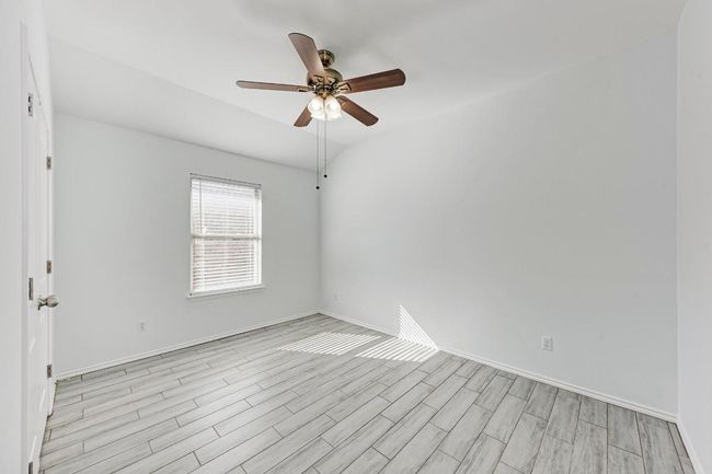 Second and third bedroom with a ceiling fan, light wood-style floors, and baseboards | Image 29