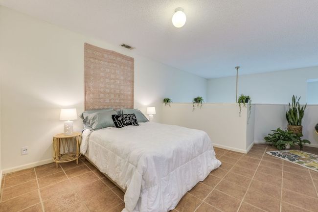 Tiled bedroom featuring baseboards | Image 17