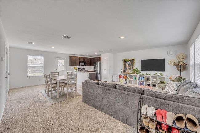 Living room featuring light colored carpet and recessed lighting | Image 8