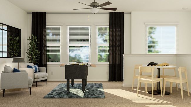 Sitting room with a ceiling fan and carpet flooring | Image 11
