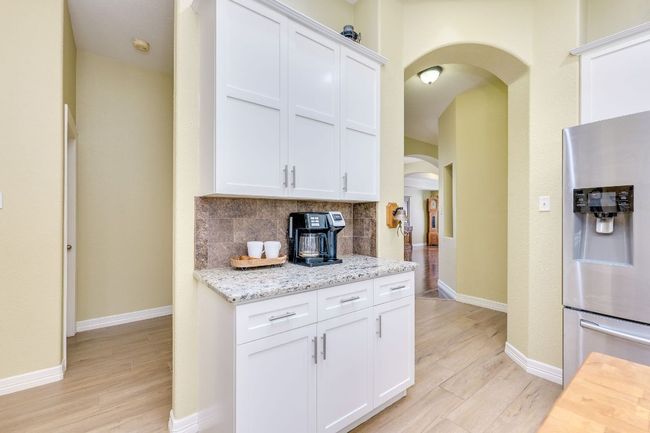 Additional counterspace and storage, perfect for a coffee bar | Image 20