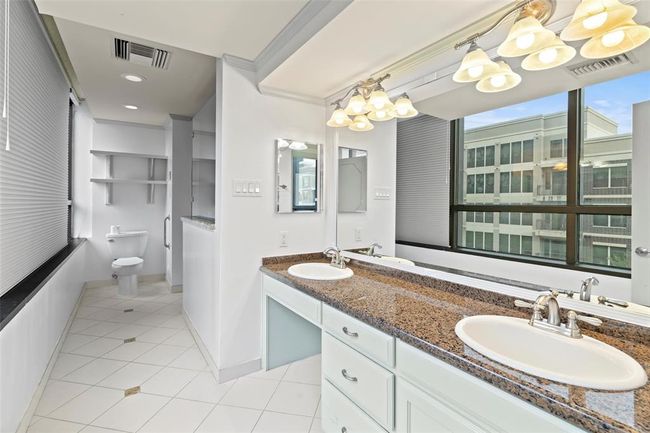 Primary bath with large walk-in shower, walk-in whirlpool tub, double sinks and heated floors. | Image 23