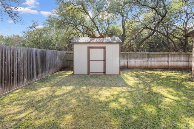 View of shed with a fenced backyard | Image 37