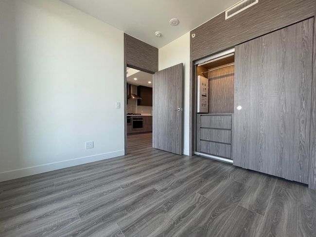 Spare room featuring baseboards, visible vents, and wood finished floors | Image 18