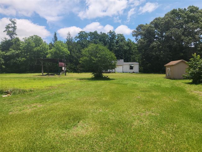 View of patio and green lawn | Image 17