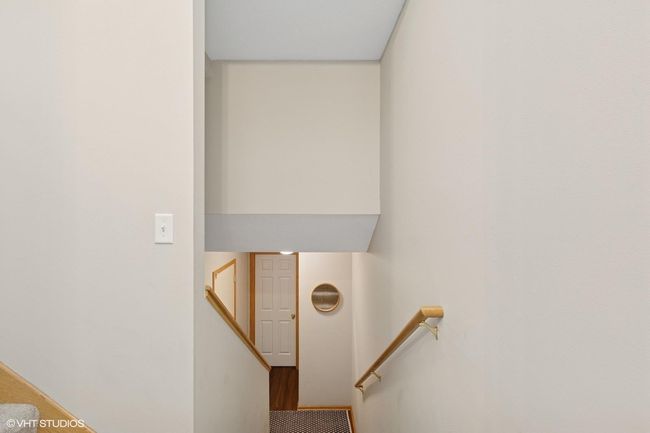 A view of the stairs leading to the garage | Image 36