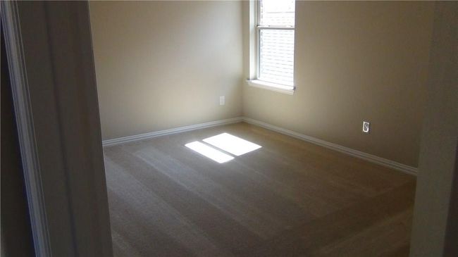 Empty room with baseboards and wood finished floors | Image 15