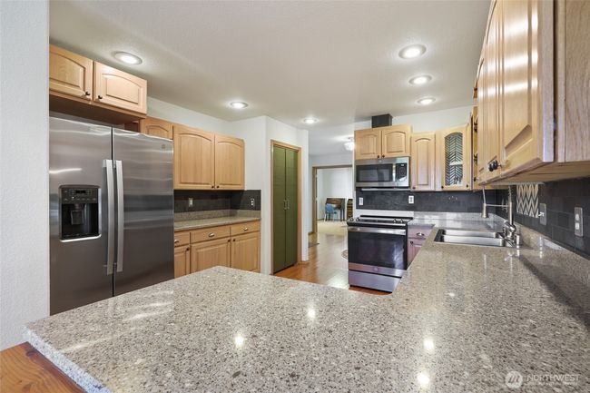 Kitchen has no shortage of counter-space. Also has a pantry seen here. | Image 17
