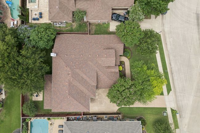 Aerial view of property and surrounding area featuring a pool area | Image 37