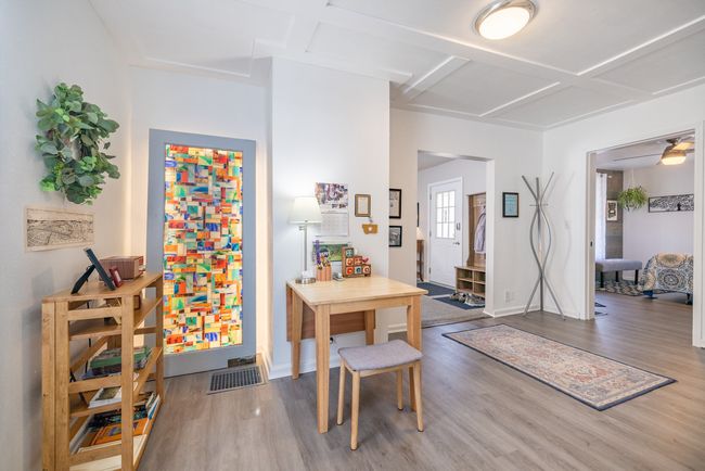 Dining area with wood finished floors, coffered ceiling, and baseboards | Image 20