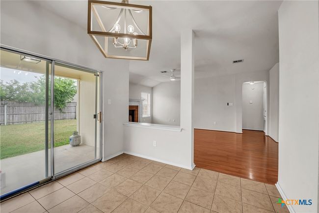 Eat in Dining with sliding glass door for easy access to the private backyard | Image 10
