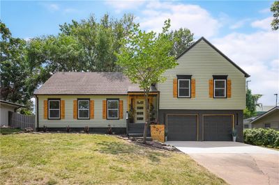 View of front of house featuring a garage and a front lawn | Image 3