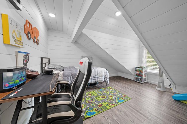 Bedroom featuring wood finished floors, crown molding, ceiling fan, and recessed lighting | Image 33