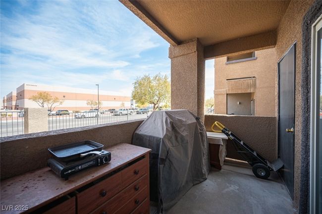 View of patio / terrace with a balcony and area for grilling | Image 30