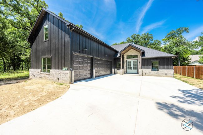 View of front of property with a garage | Image 23