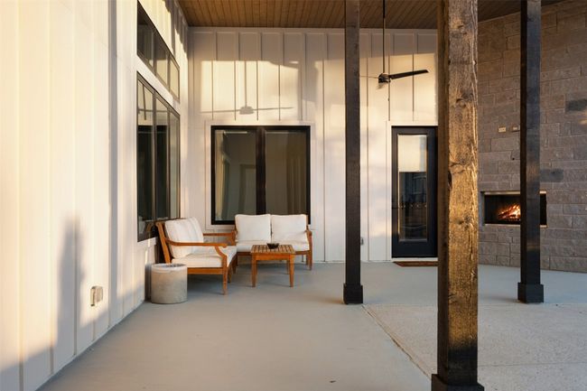 Large covered patio with outdoor fireplace. Plumbed for outdoor kitchen. | Image 35