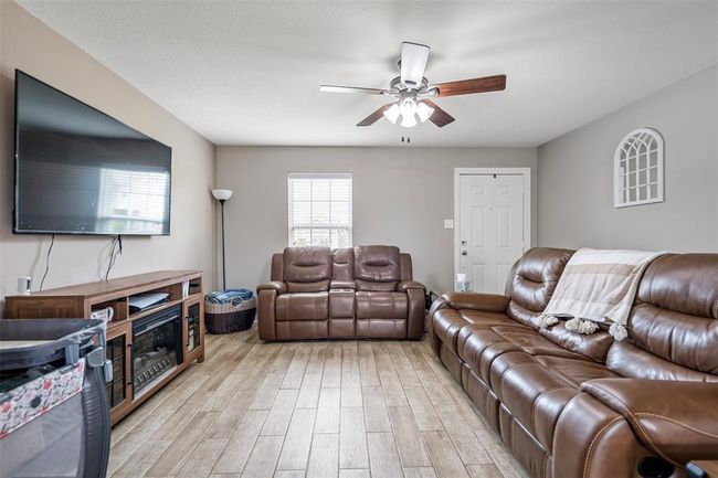 Living room with wood plank tile all on downstairs | Image 5