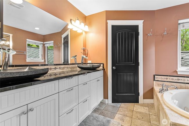Dual sinks and a door on the commode for extra privacy. | Image 19